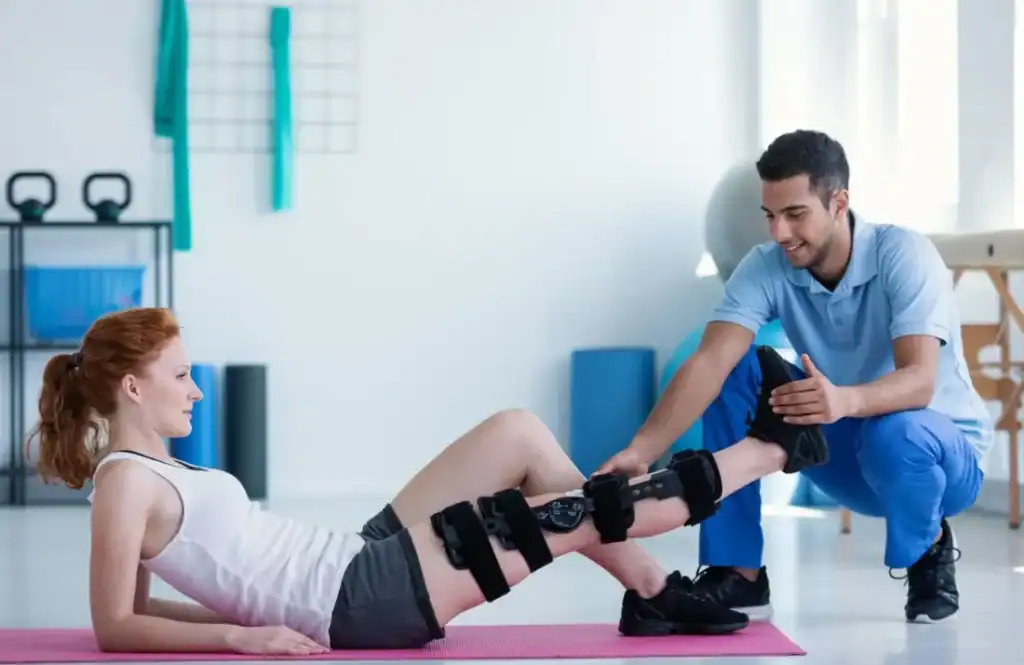 Woman having treatment to help muscle recovery Bognor Regis after an injury