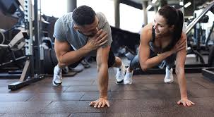 Image of man and woman doing Cardio Bognor Regis to tone their arms. 